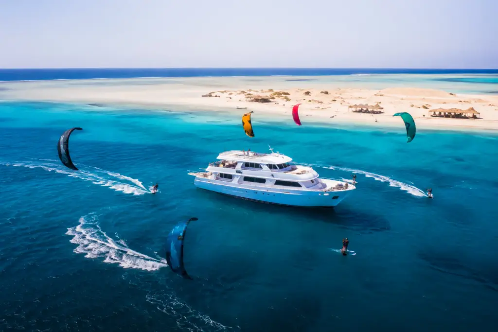 Kite trip with kitesurfers exploring a windy destination